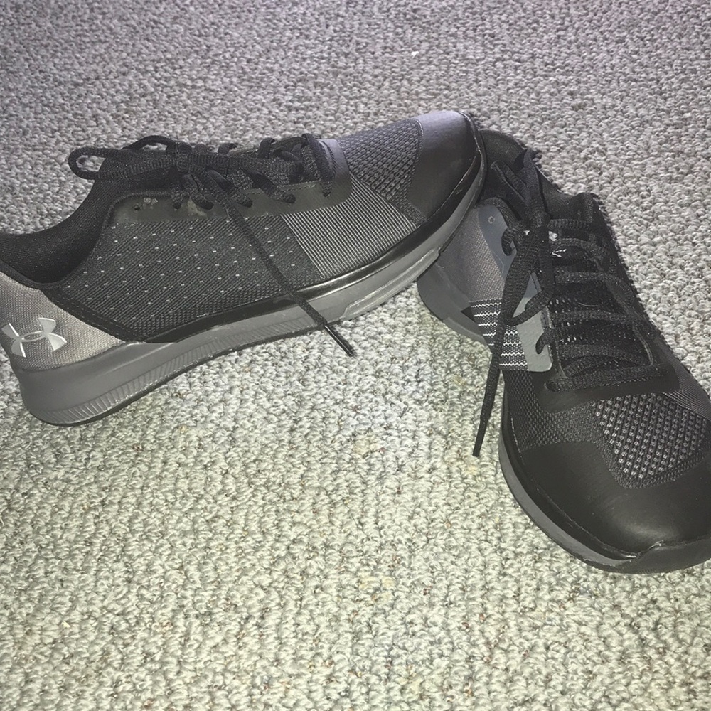 Black and greyish Under Armour shoes